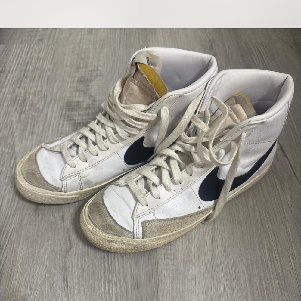 White and Black High-Top Nike Blazer Sneakers